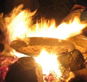 flames coming up round chapati pan with raised edges